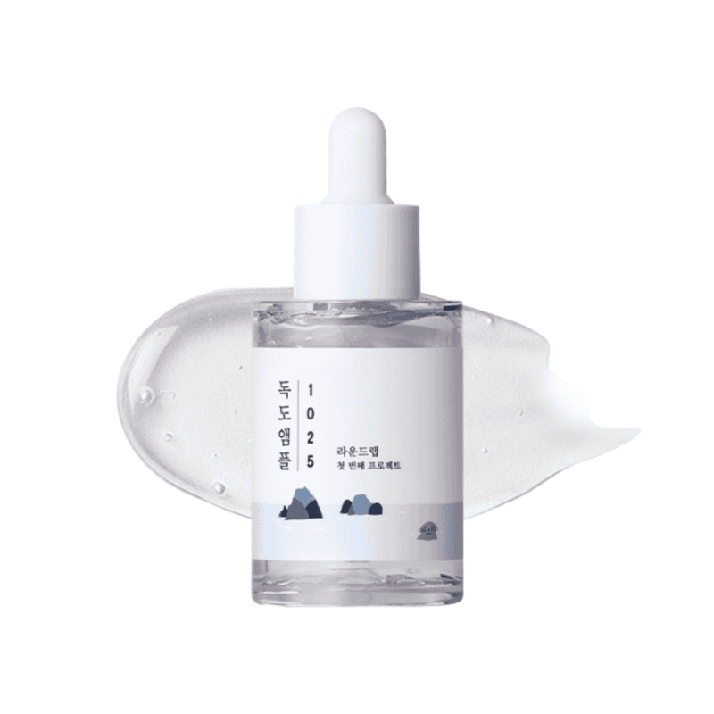 Frasco da 1025 Dokdo Ampola 200ml da Round Lab, tratamento intensivo para hidratação profunda e fortalecimento da barreira cutânea.