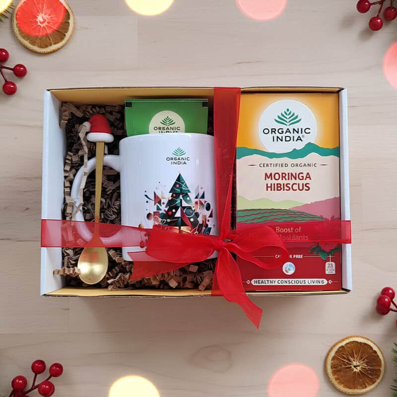 Infusão ayurvédica Moringa Hibiscus Organic India em embalagem de Natal, com mistura herbal biológica e design festivo.