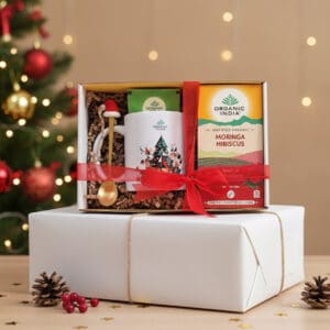Infusão ayurvédica Moringa Hibiscus Organic India em embalagem de Natal, com mistura herbal biológica e design festivo.