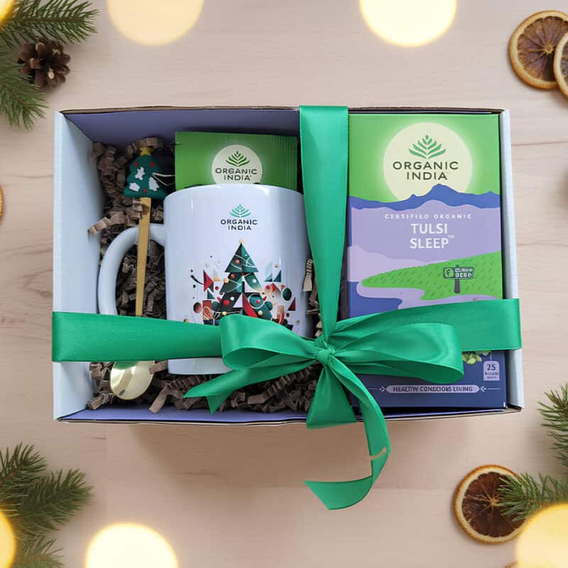 Infusão ayurvédica Tulsi Sleep Organic India em embalagem de Natal, com mistura biológica relaxante e elementos festivos.